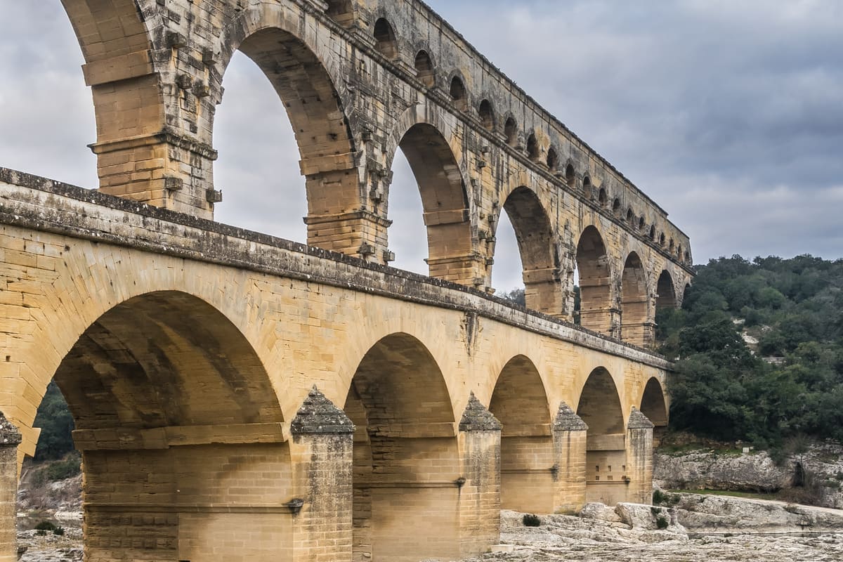 The Pont du Gard — a 49-metre-tall three-tier Roman aqueduct bridge spanning the Gardon river in southern France